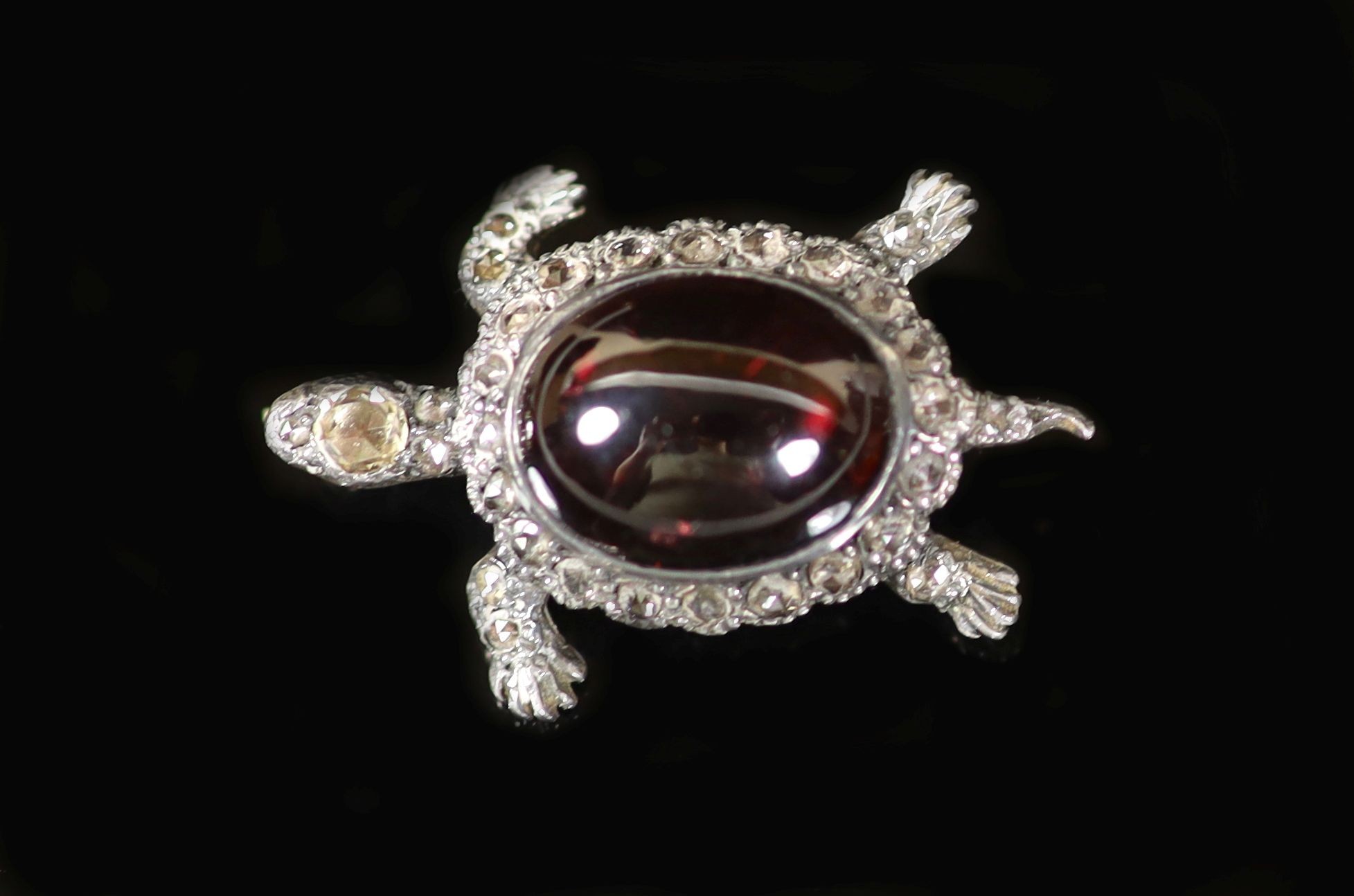 An Edwardian gold and silver, cabochon garnet and diamond set brooch, modelled as a tortoise